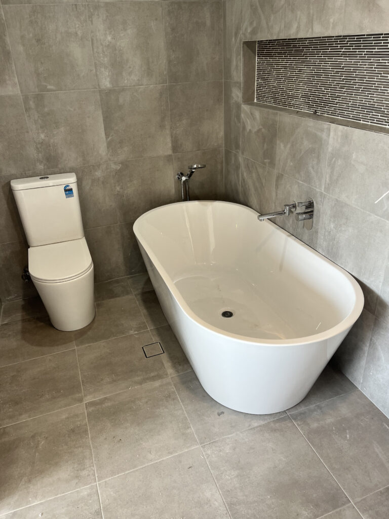 Frontline Plumbing Group Bathtub and Toilet Installation